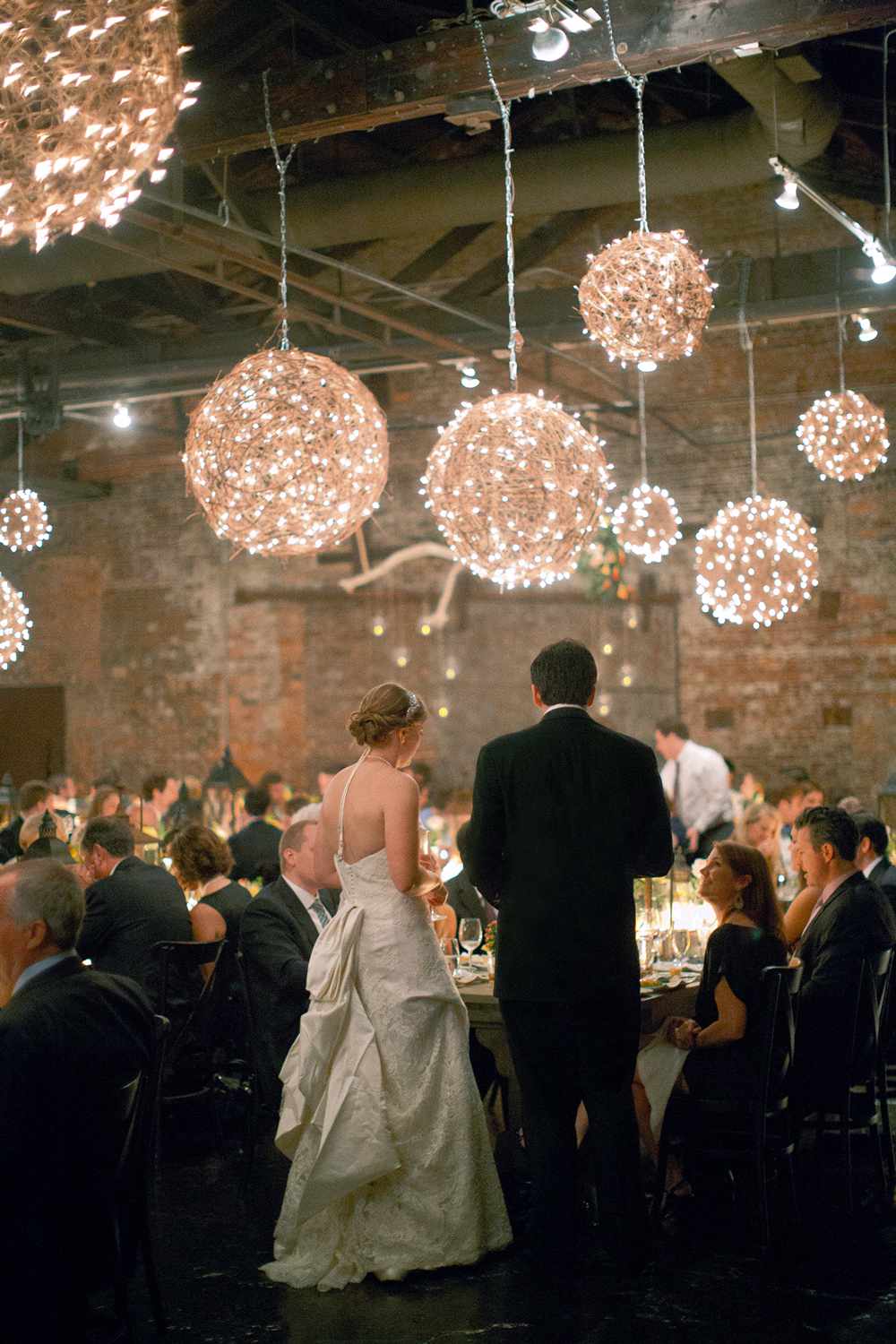 twinkle lights orbs above reception tables