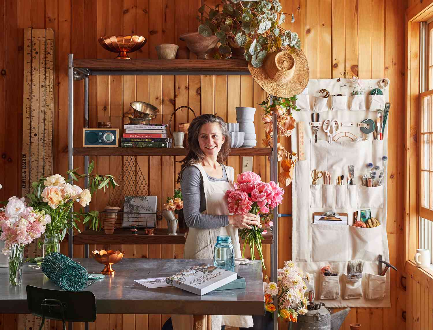 woman flower arrangement storage workshop space