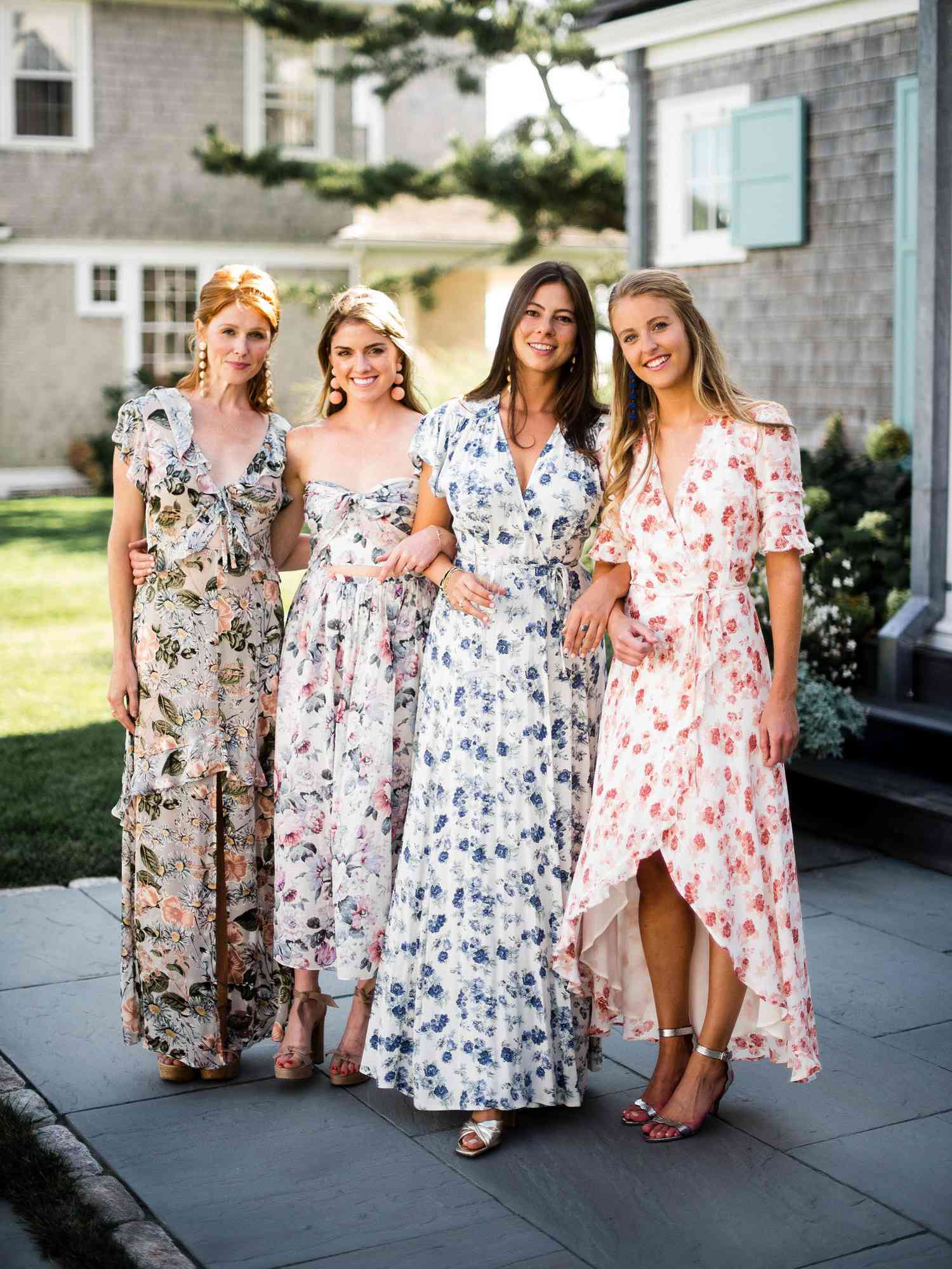chic bridesmaids long floral dresses with earrings