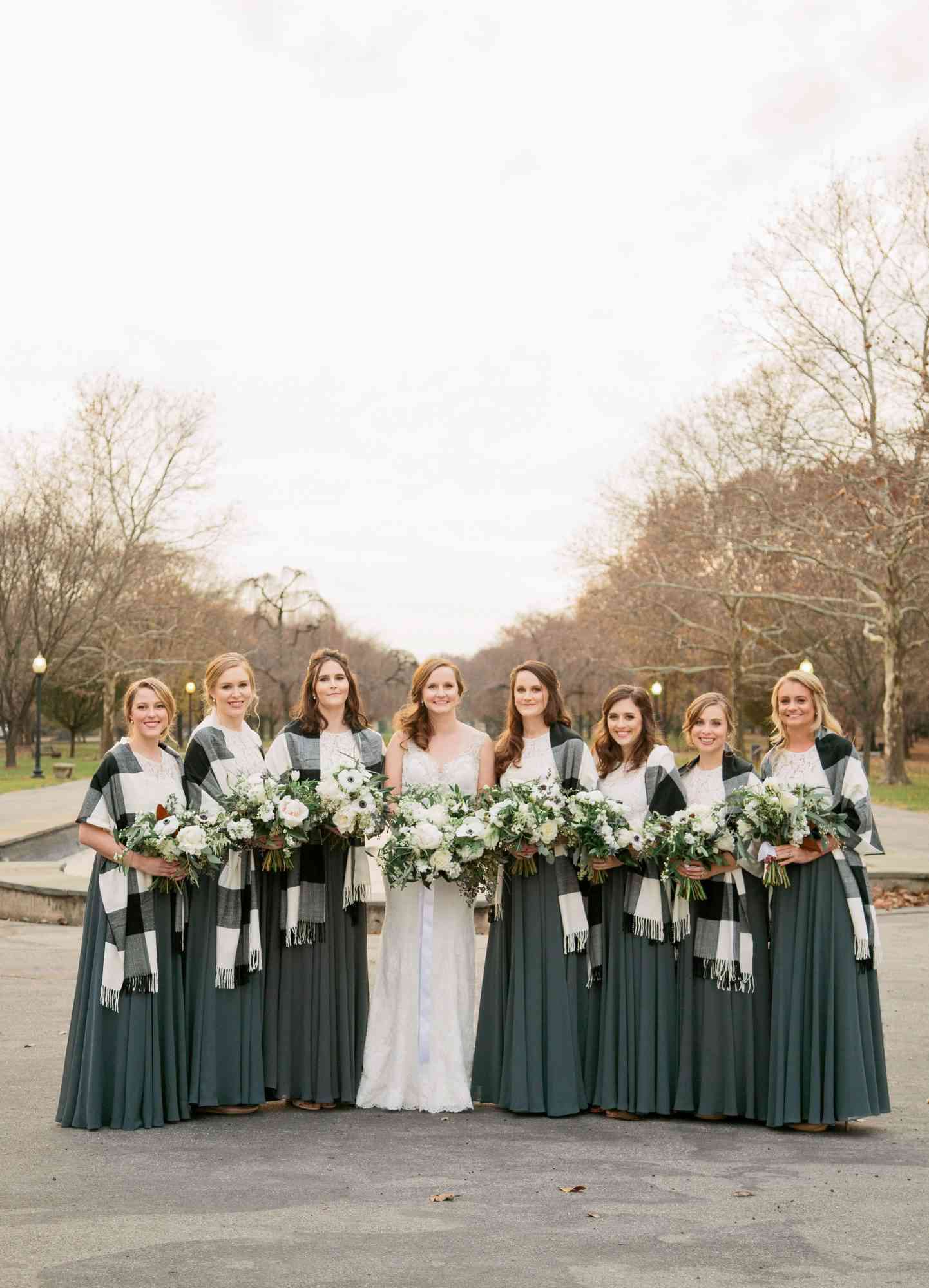 bride and bridesmaids white lace tops dark green skirts