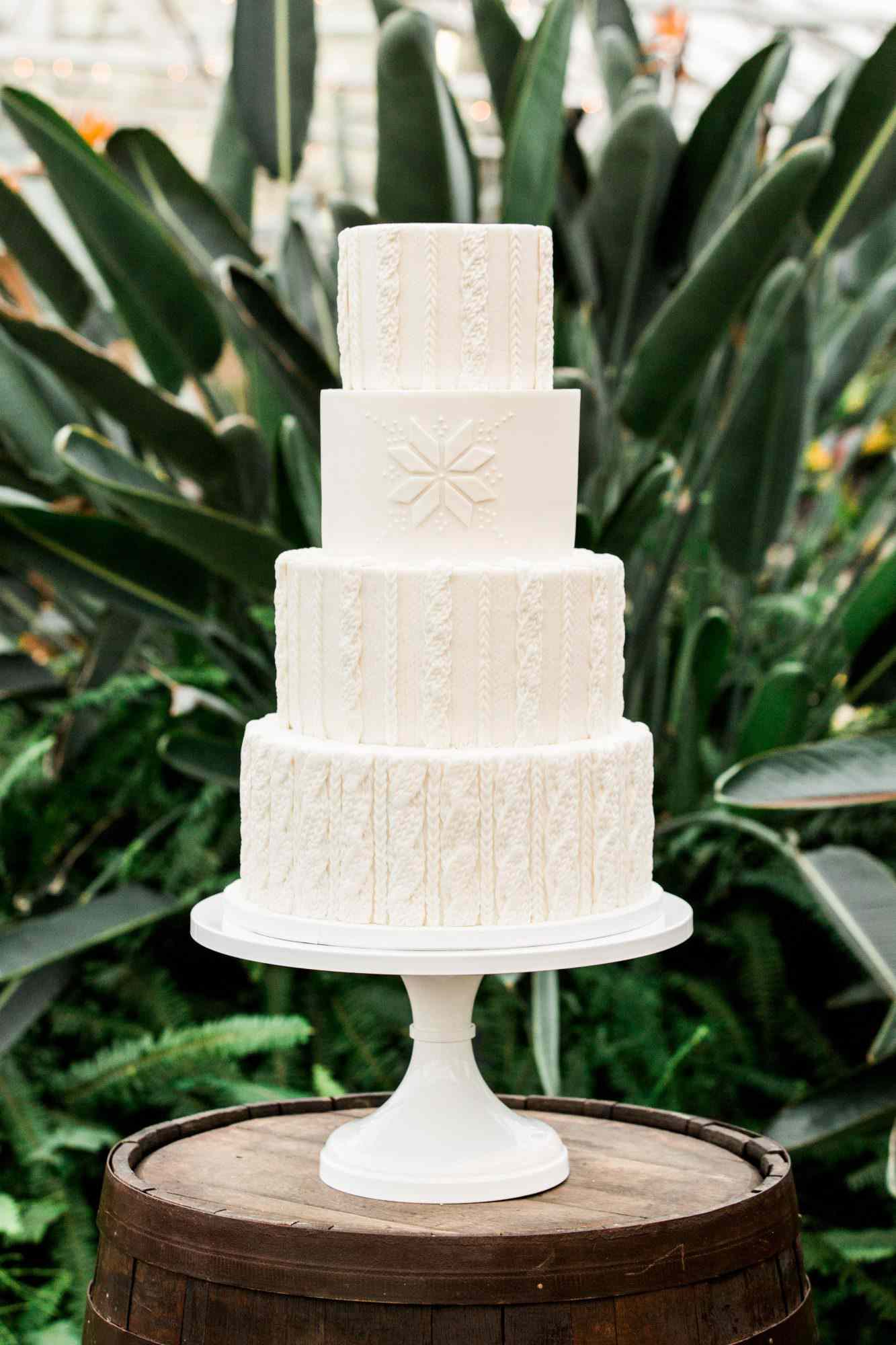 four tier wedding cake with sweater design