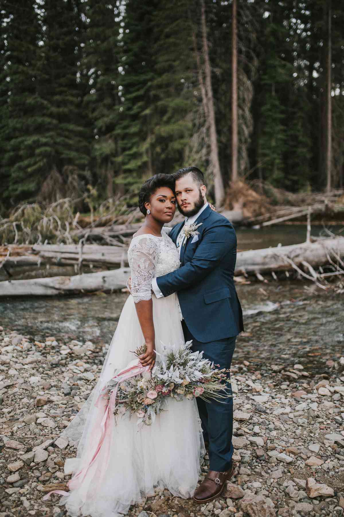 elopement outfit inspiration couple embracing in forest