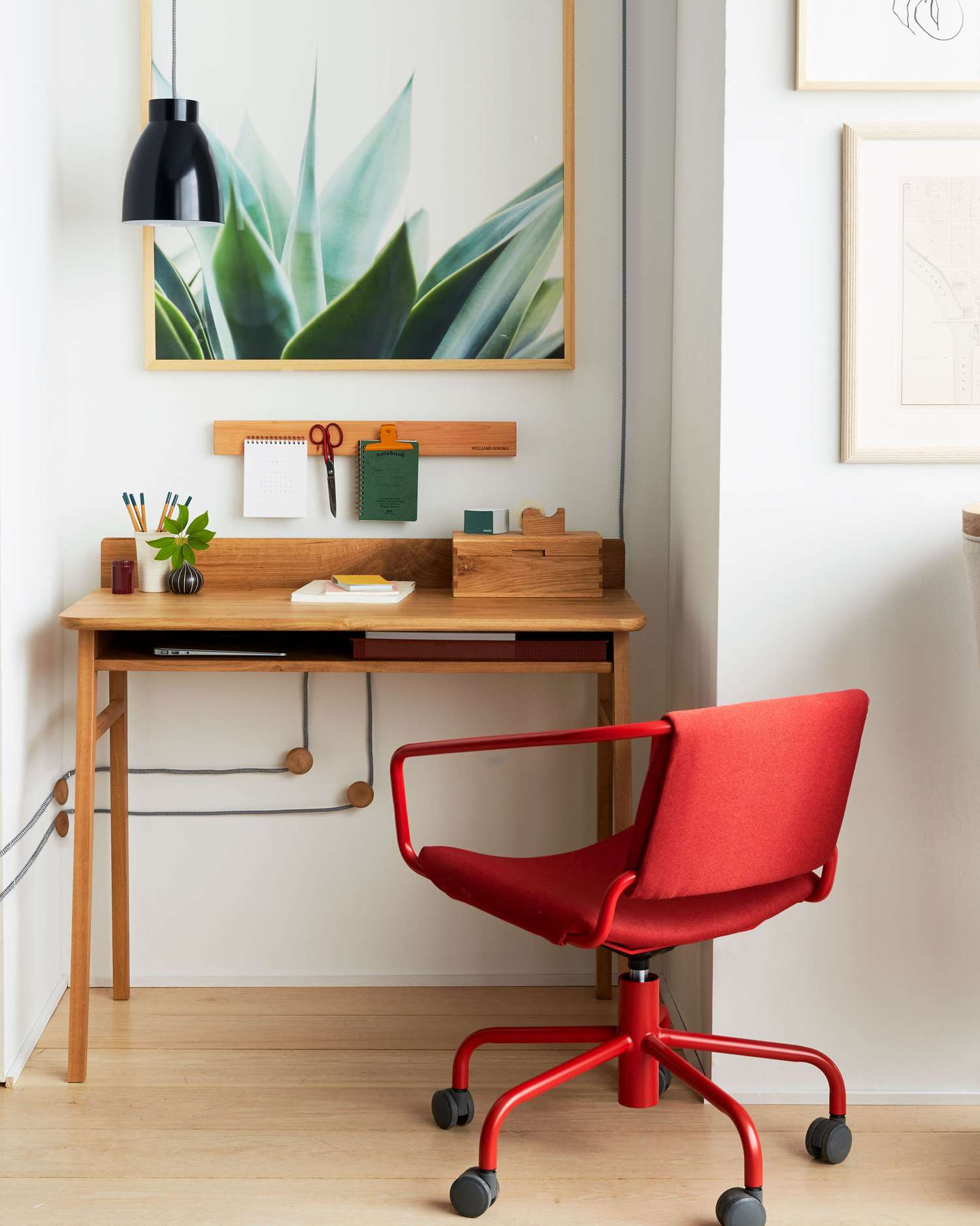 wood office desk with red chair on wheels