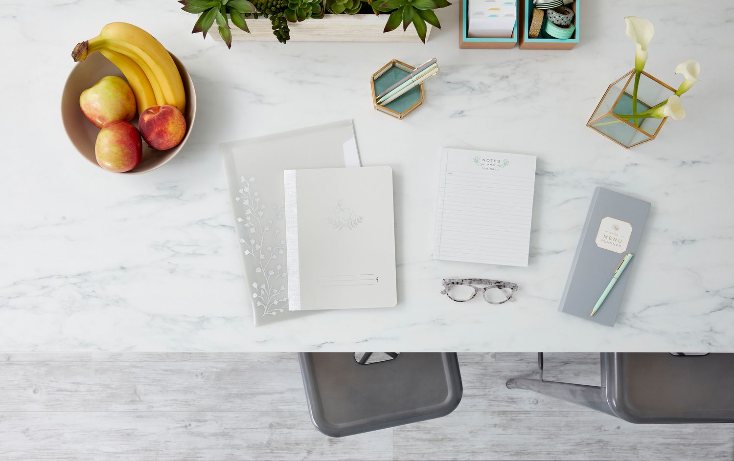 gray office supplies on marble desk
