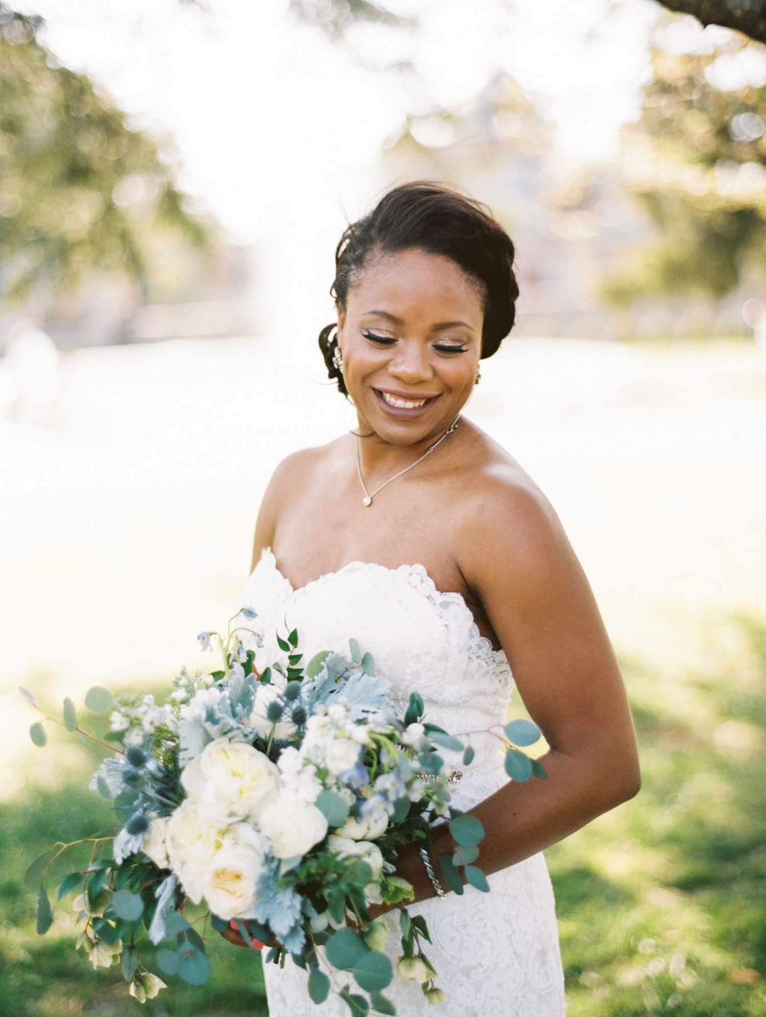 wedding bride holding bouquet white blue flowers