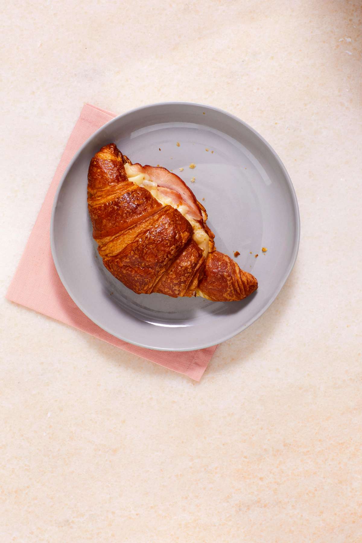 twice-baked ham croissant served on a gray plate