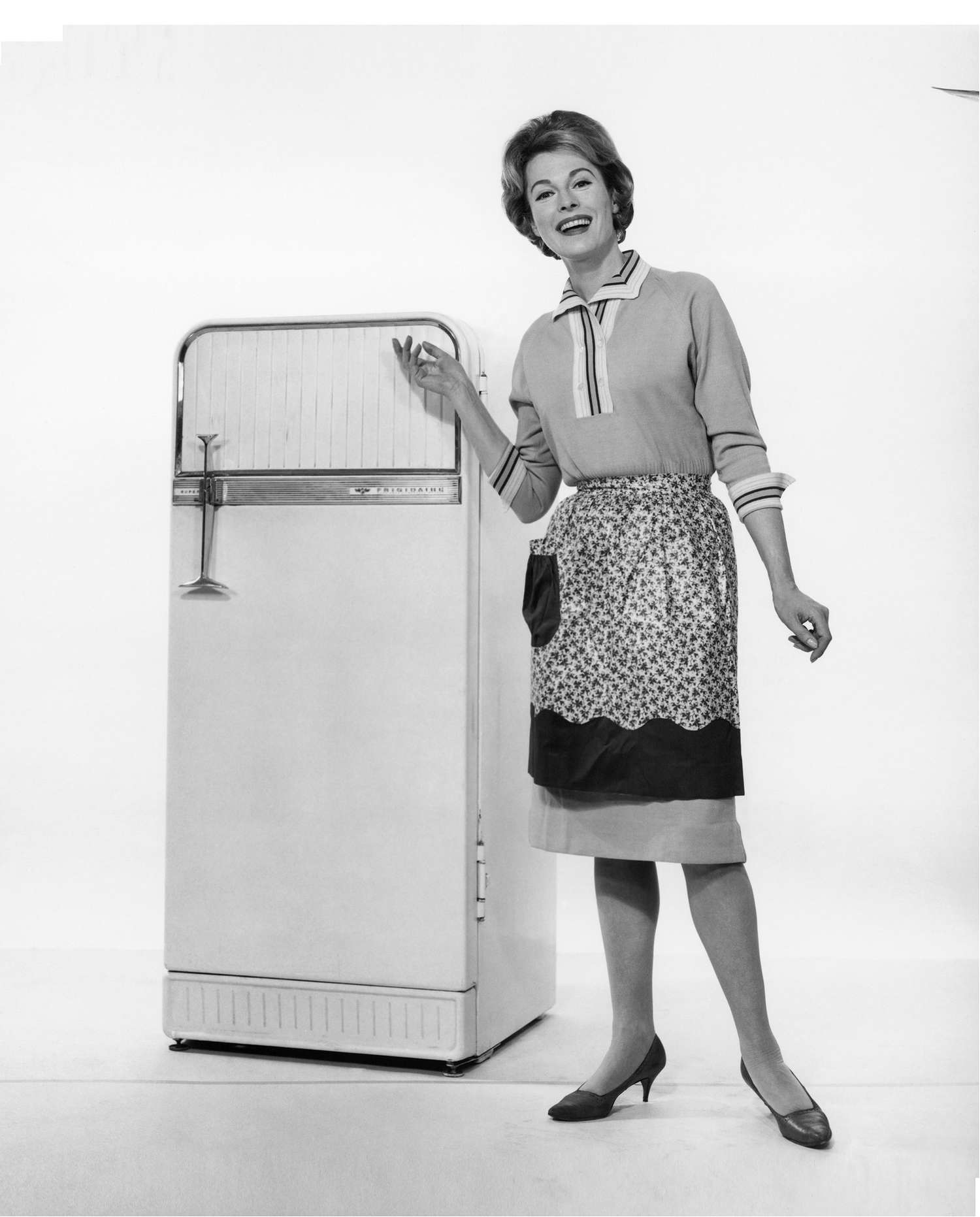 woman posing in front of vintage fridge