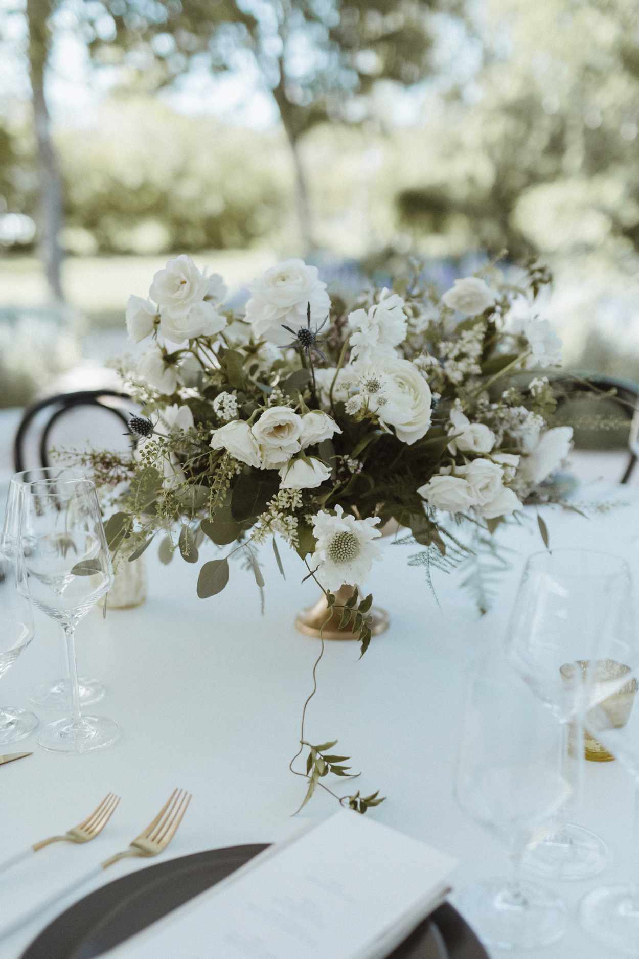 white and green muted blooms centerpieces