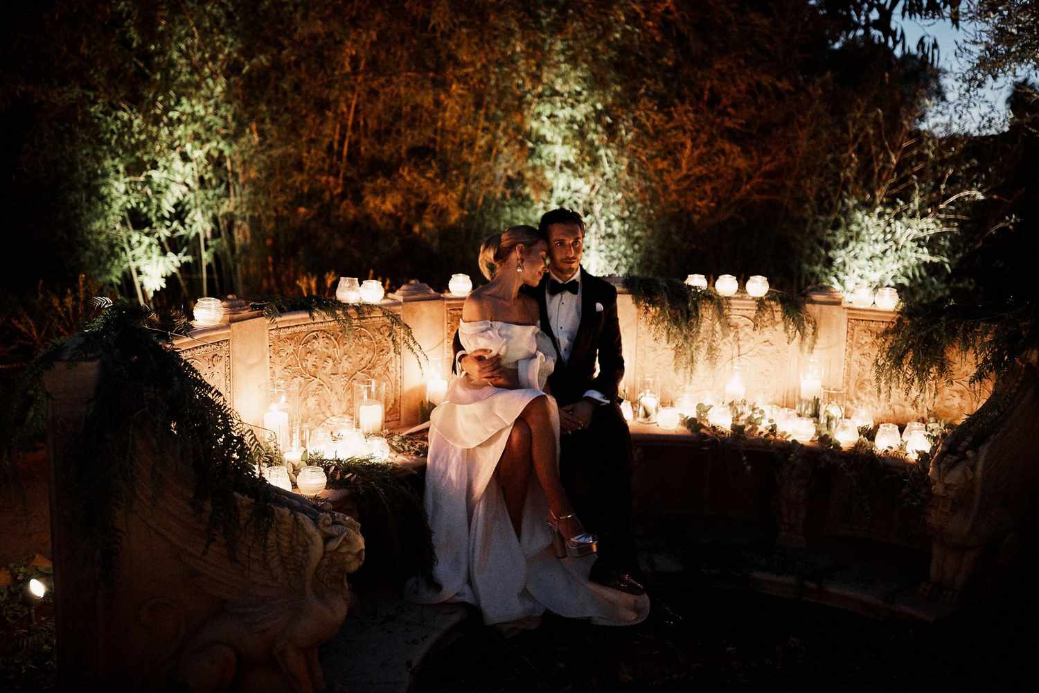 karolina sorab wedding couple hugging surrounded by candles