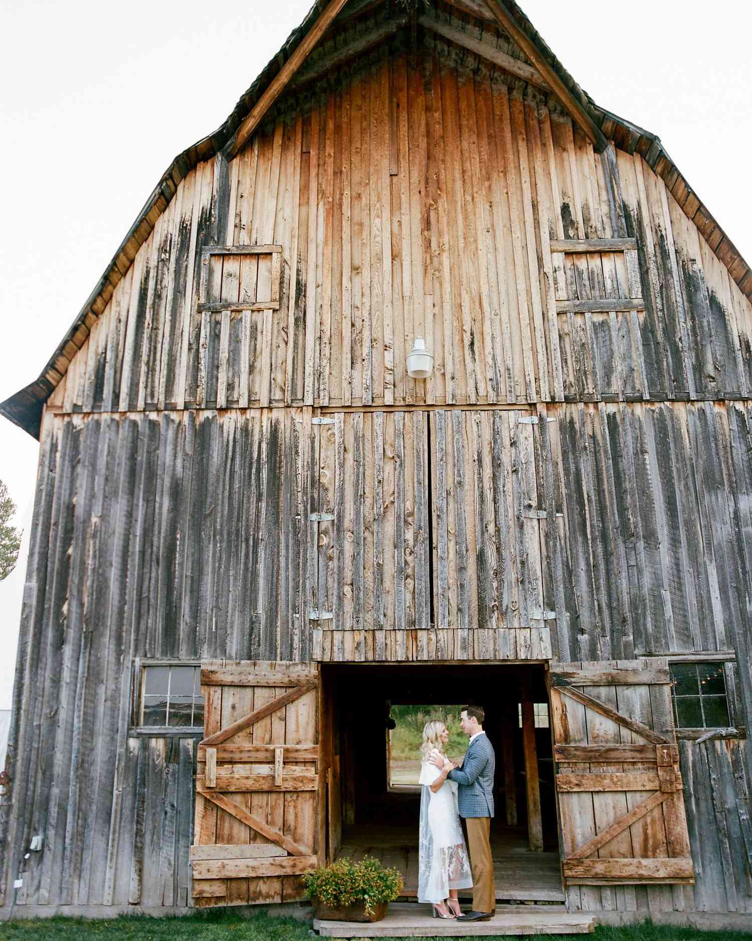 couple under barn doorway