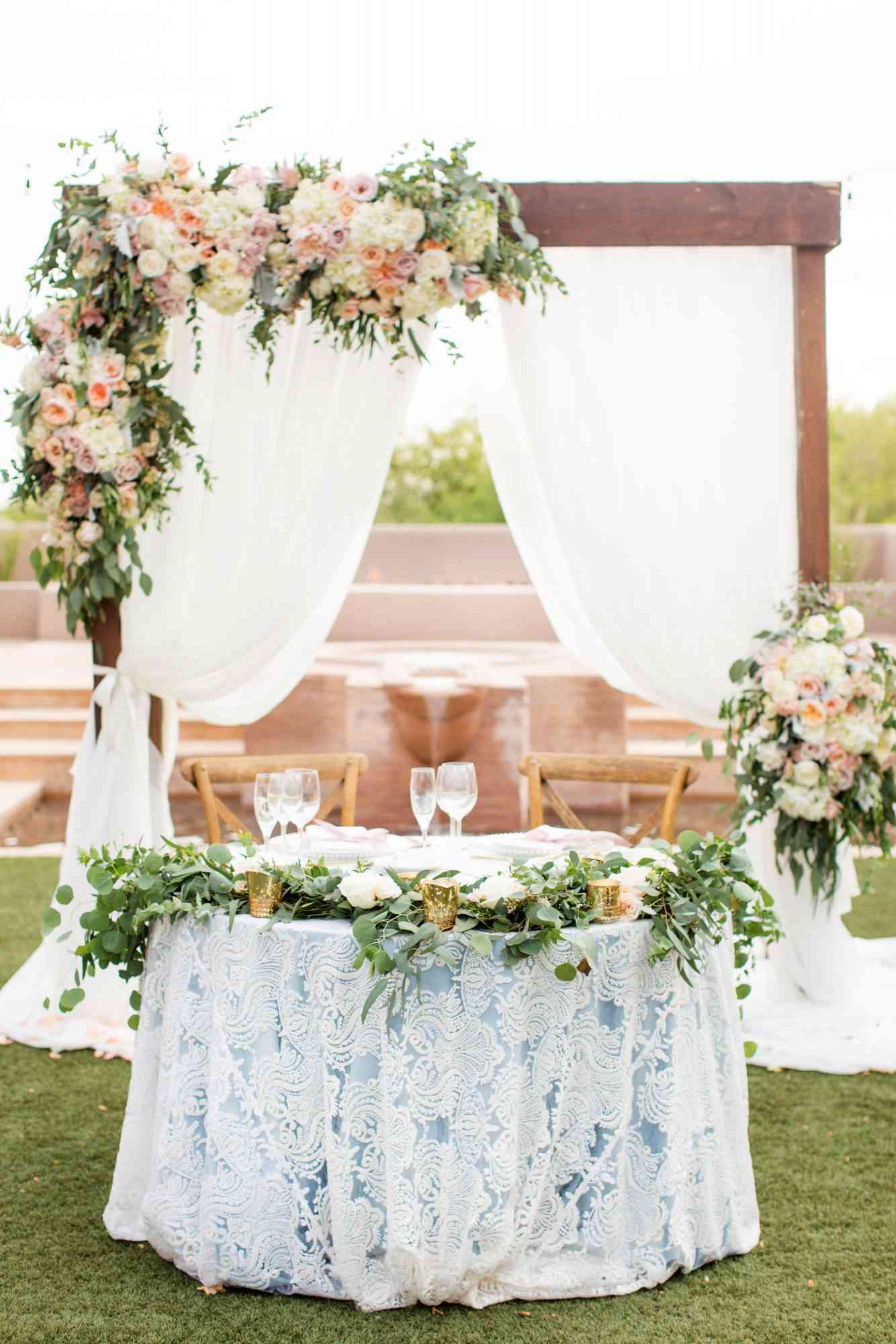 sweetheart table lace table and floral backdrop
