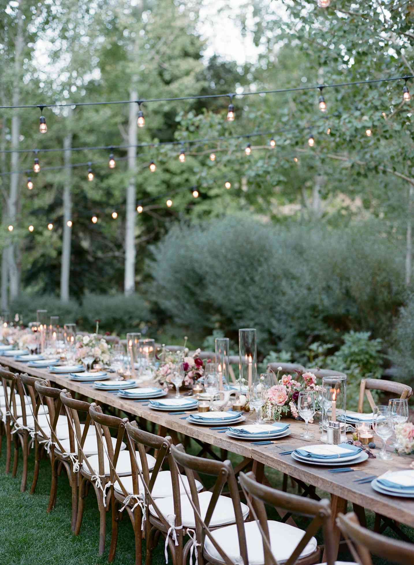 long wooden tables with blue and white placesettings