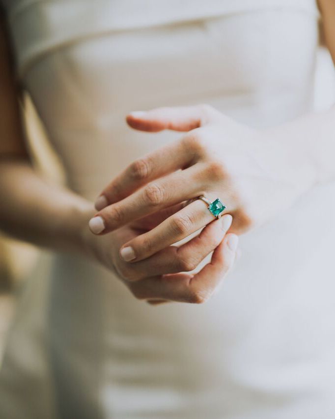 cathleen and winston wedding bride wearing emerald ring