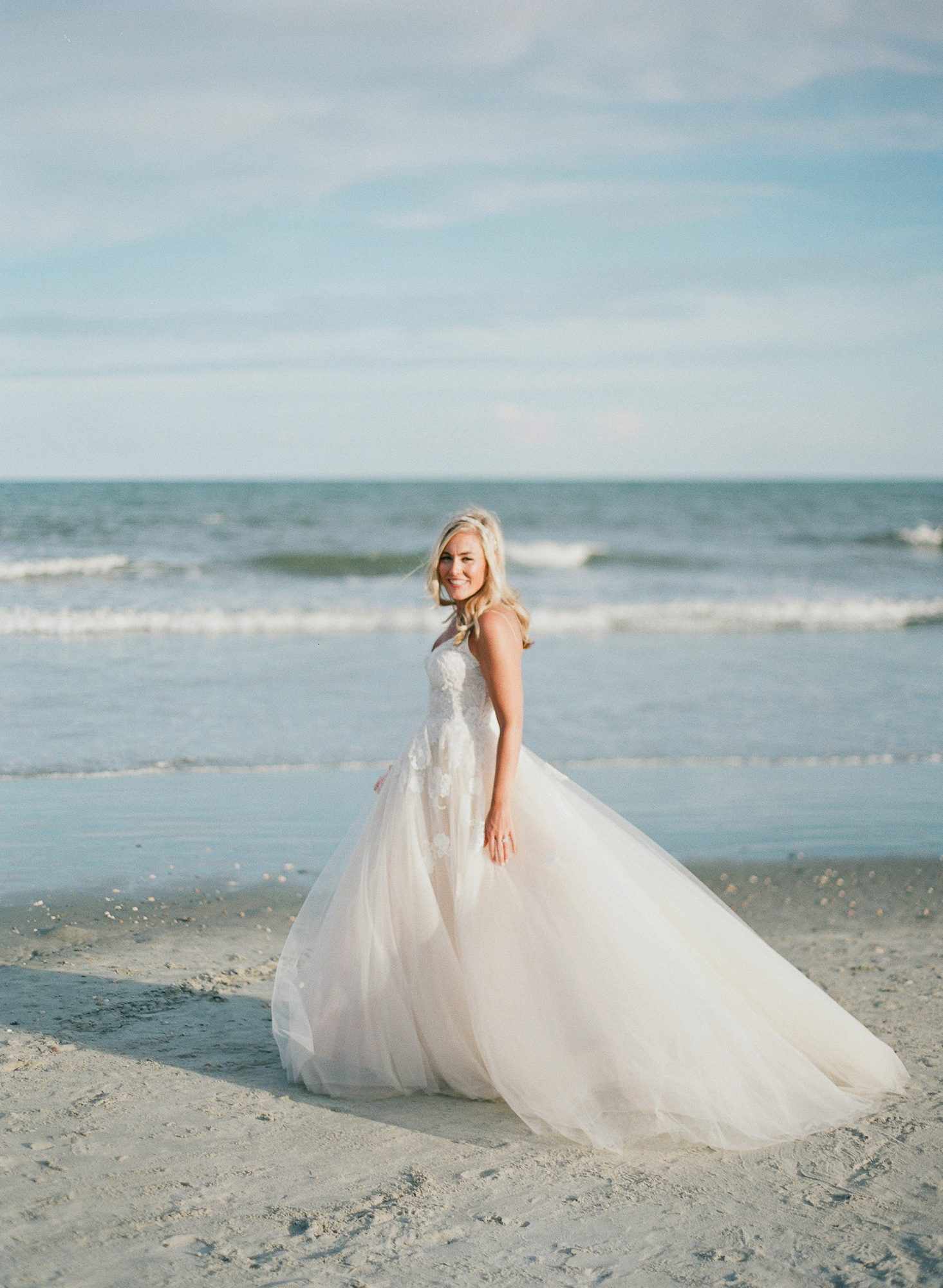 beach wedding dresses bride in ball gown on the beach