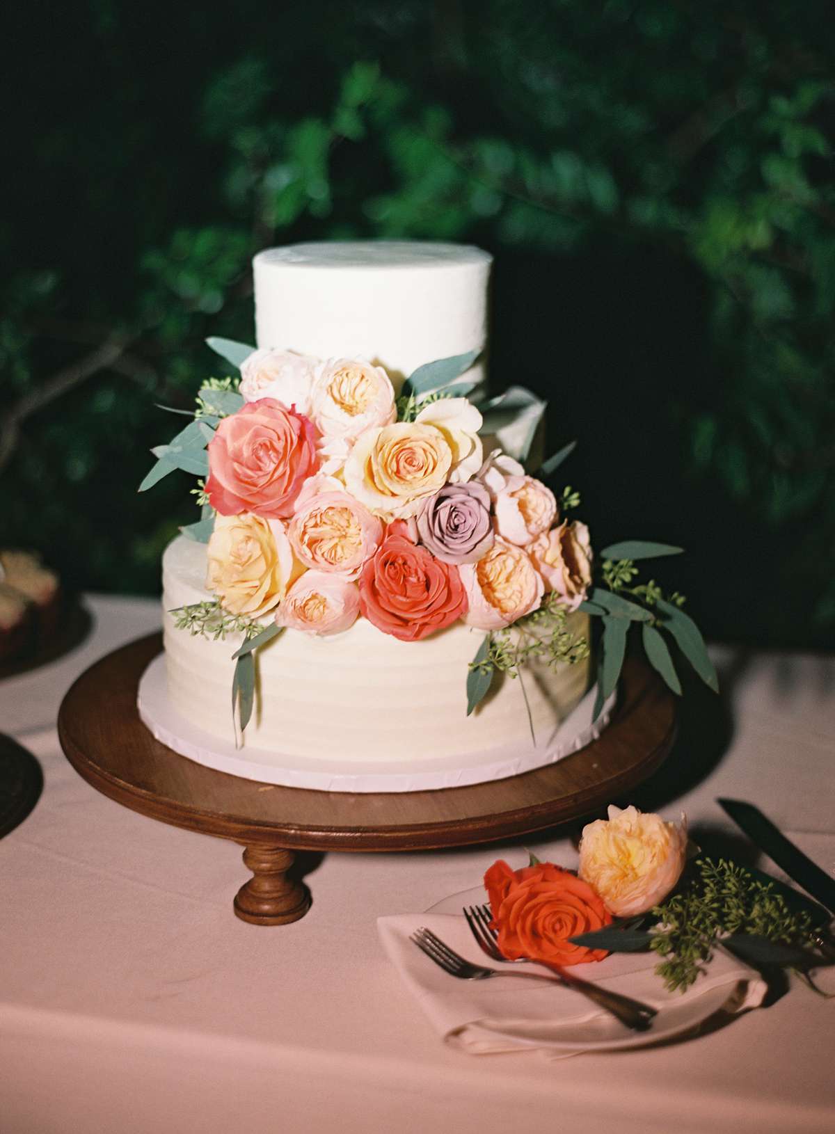 earl gray frosted wedding cake with floral accents