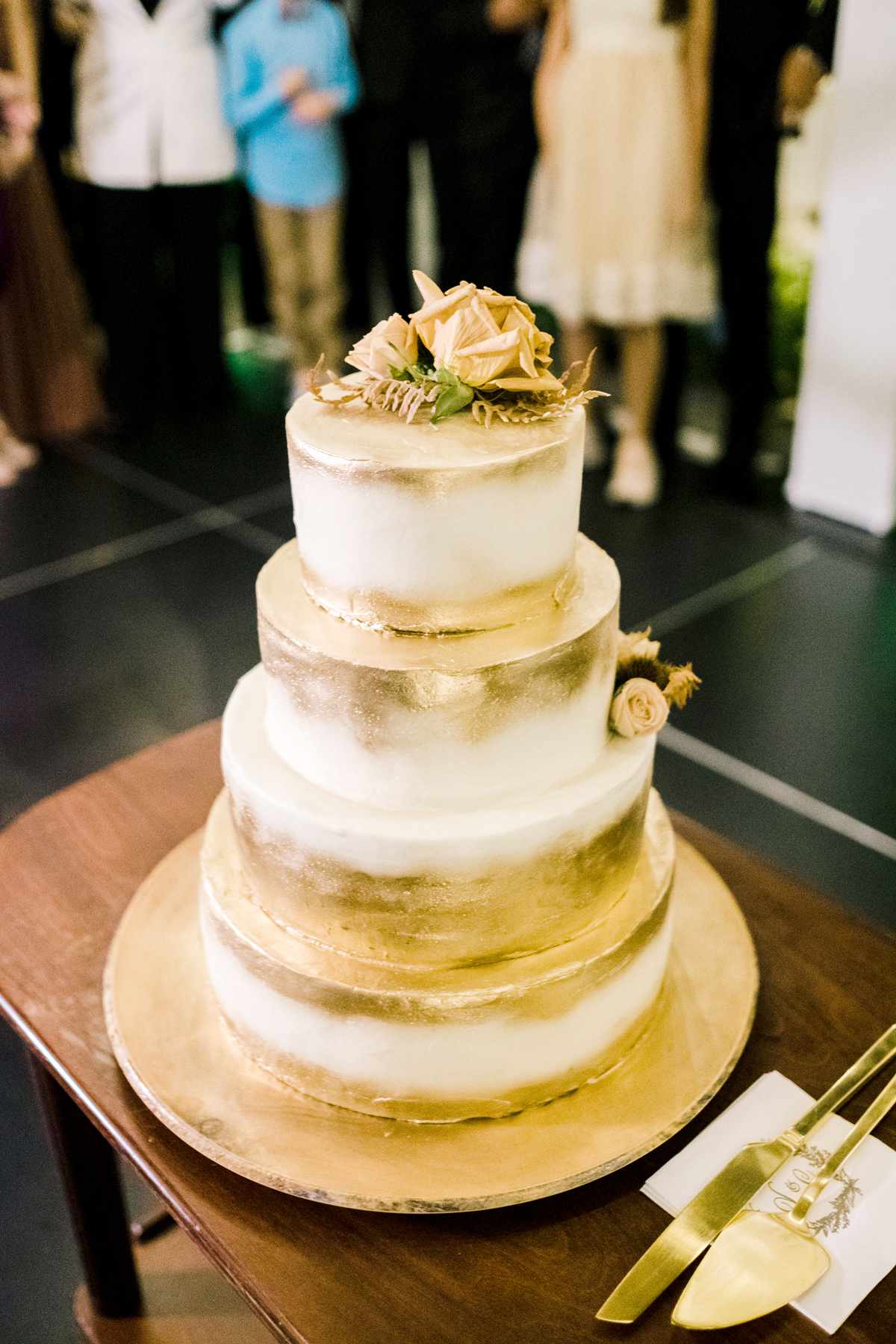 marshmallow butter cream covered four-tier wedding cake