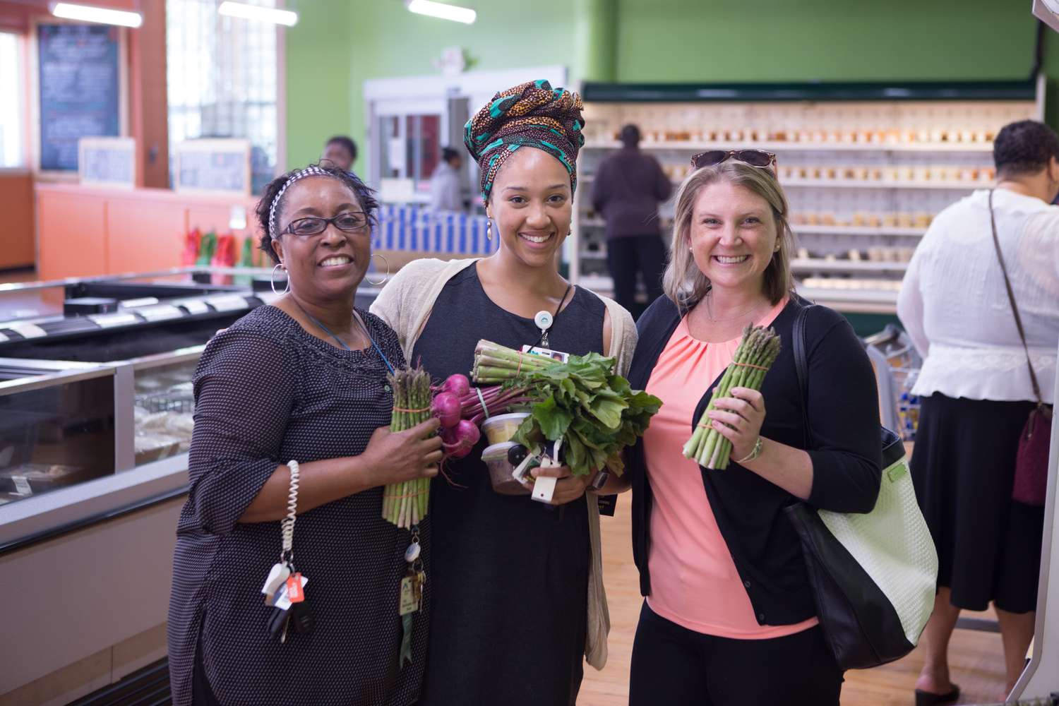women with fresh produce at Daily Table store