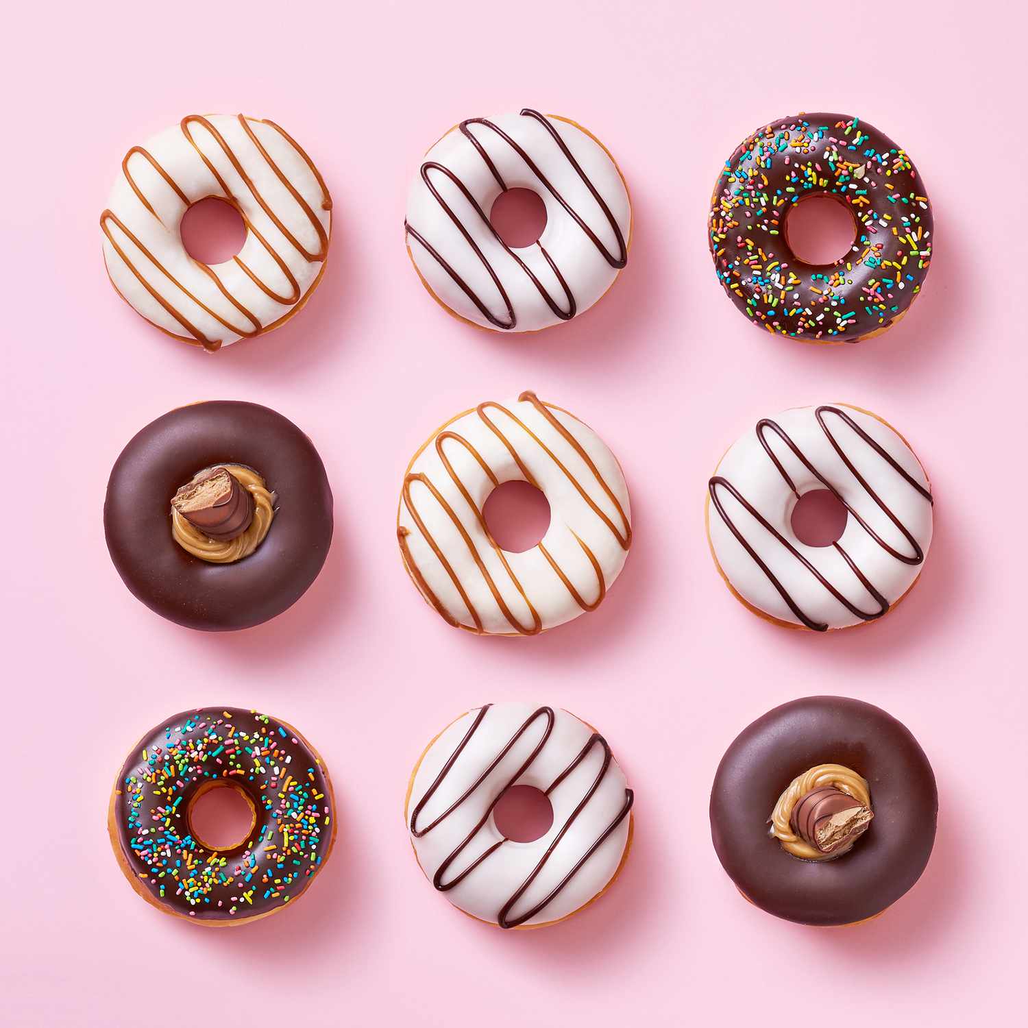 Selection of Donuts on a Pink Background