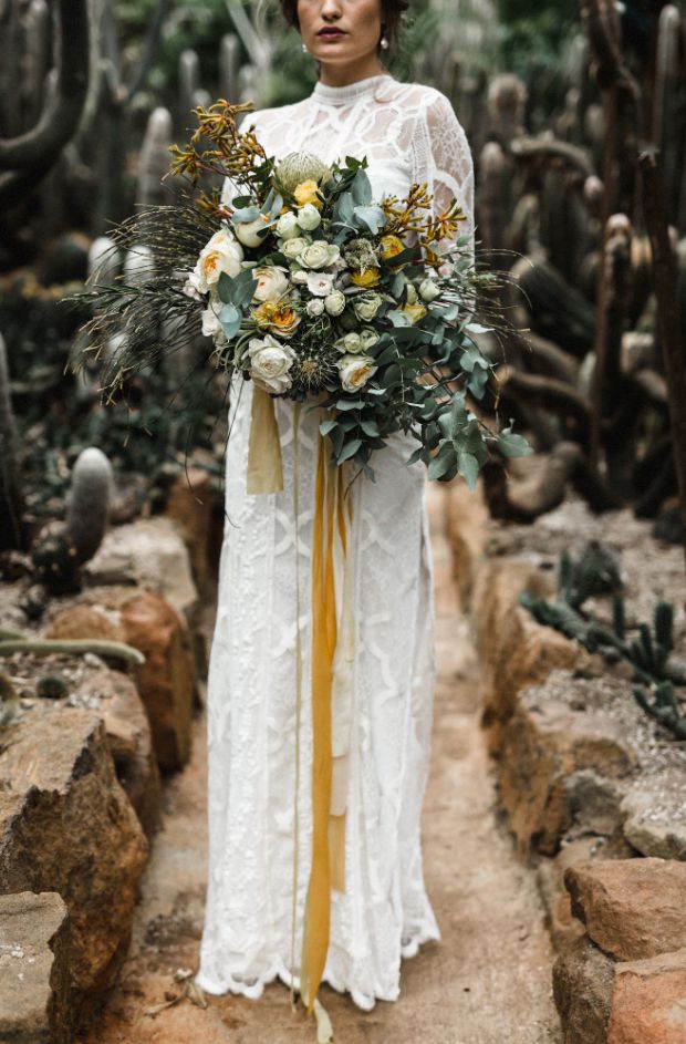 yellow, white, and green bouquet with ribbons