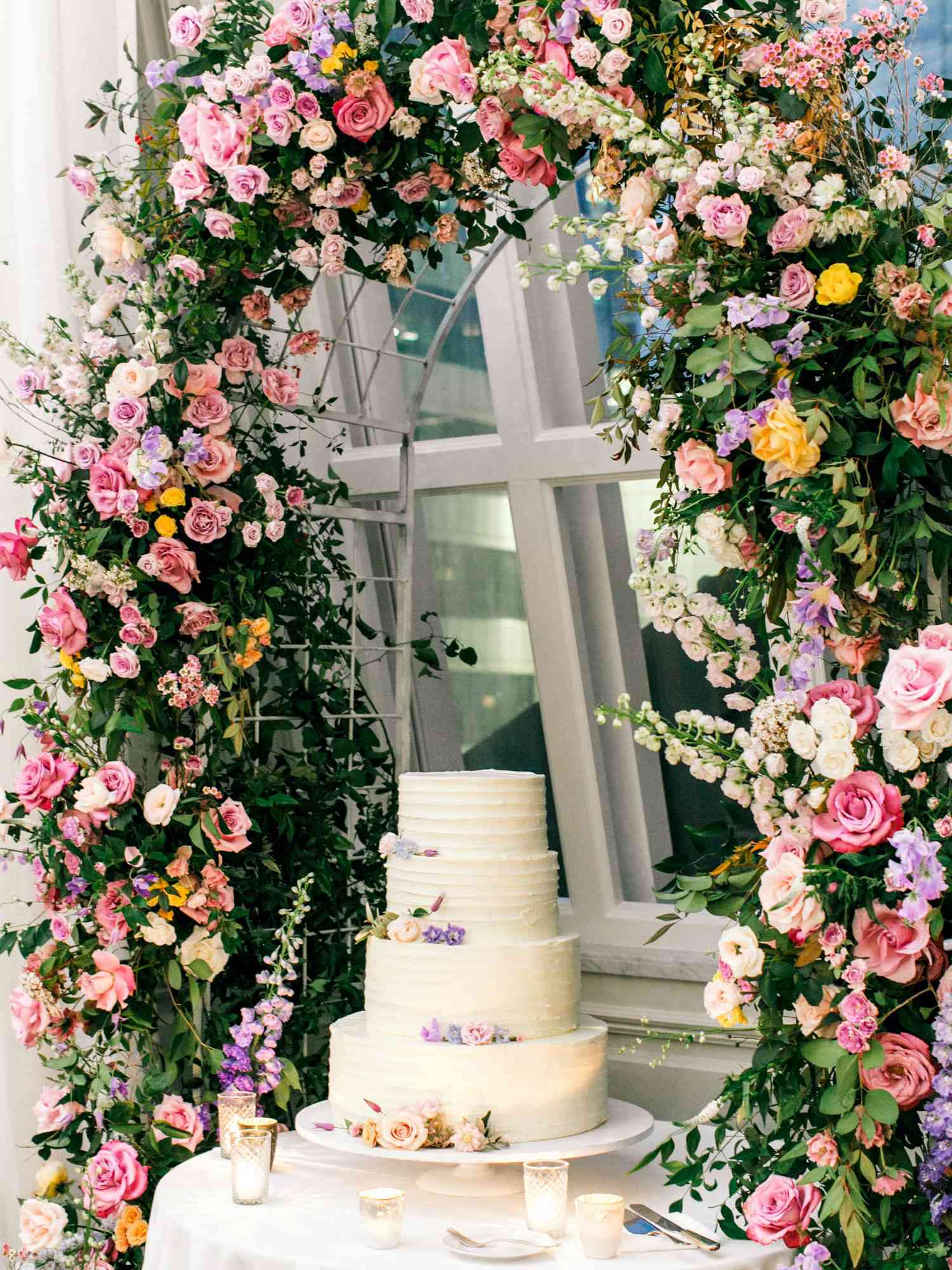 stephanie joe wedding cake and floral arch