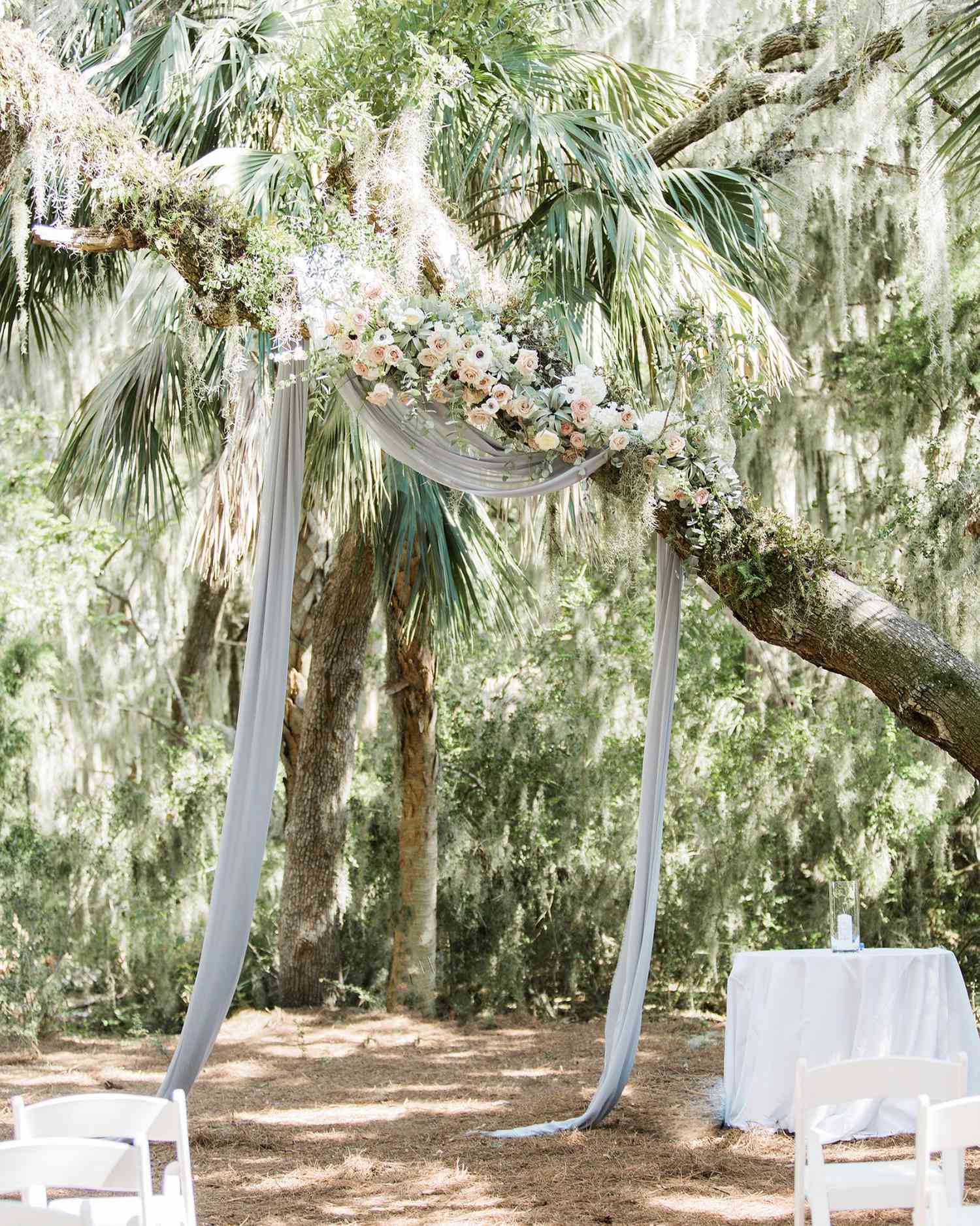 muted blue tulle hanging from tree
