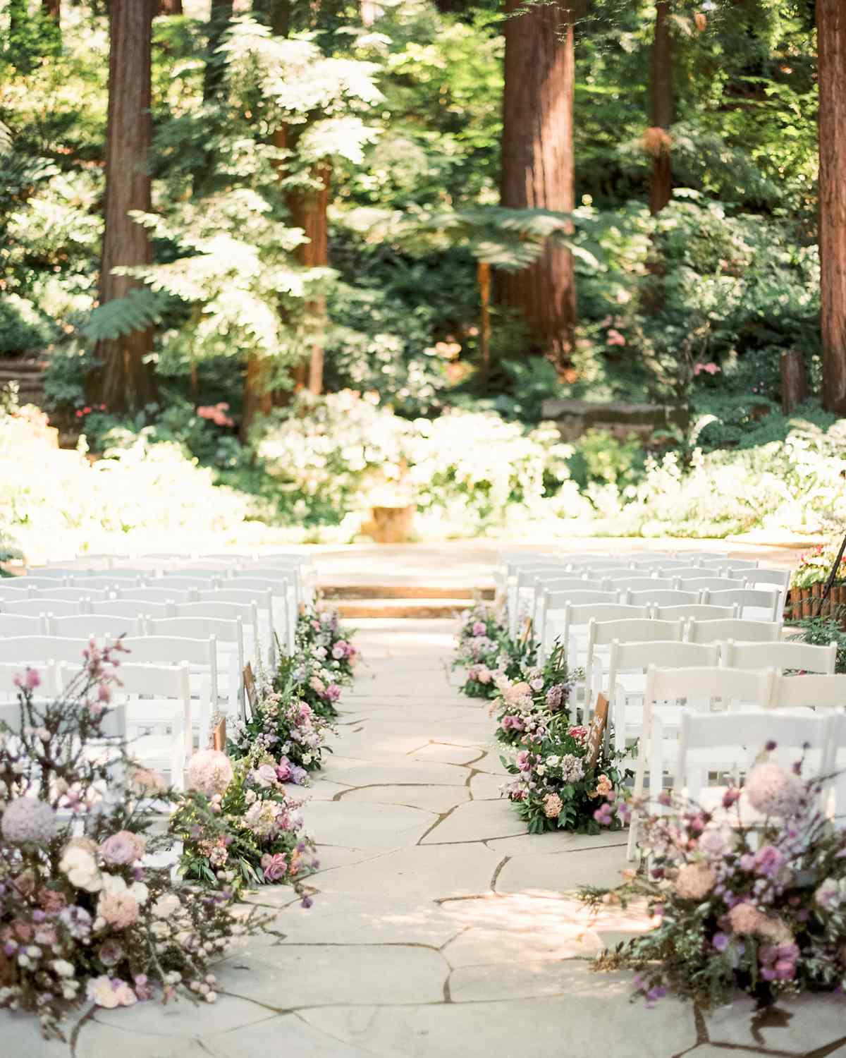 woodsy floral arrangements wedding aisle