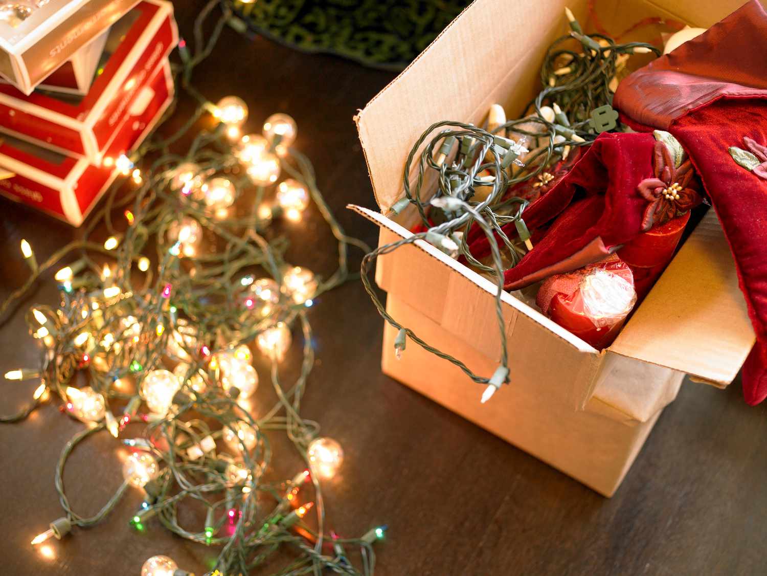 a box of string holiday lights on the floor