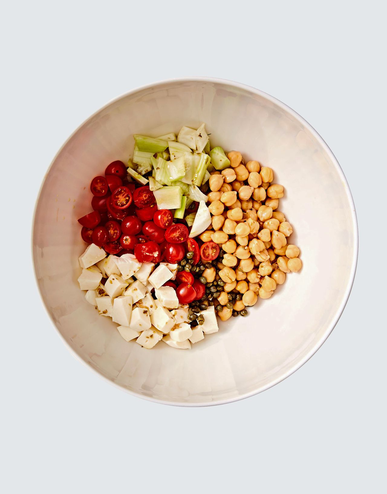 pasta salad ingredients in white bowl