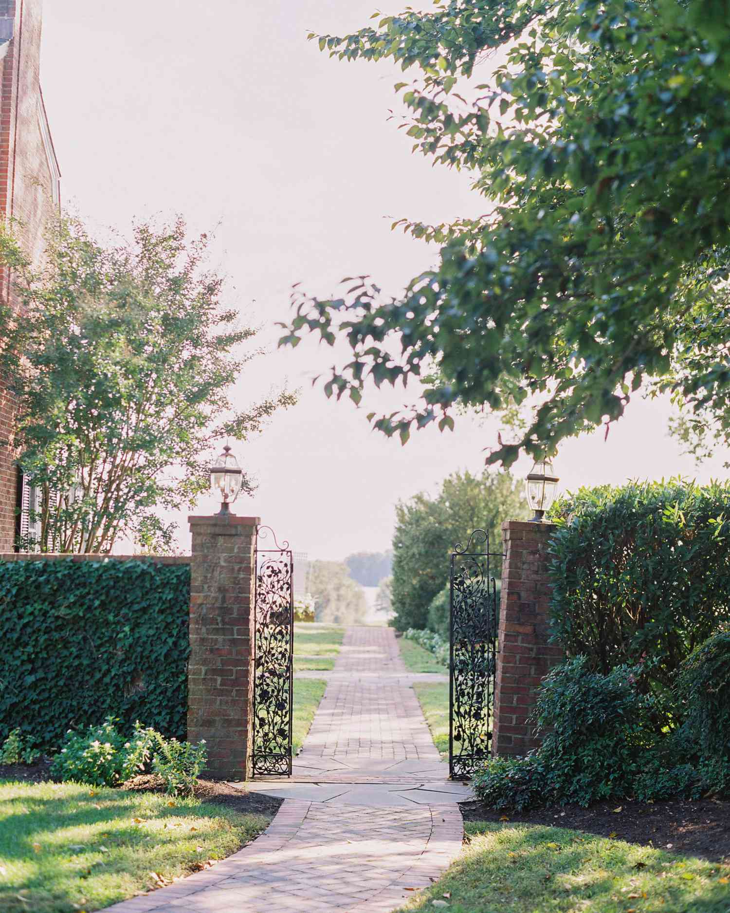 outdoor wedding venue gated entryway brick walkway