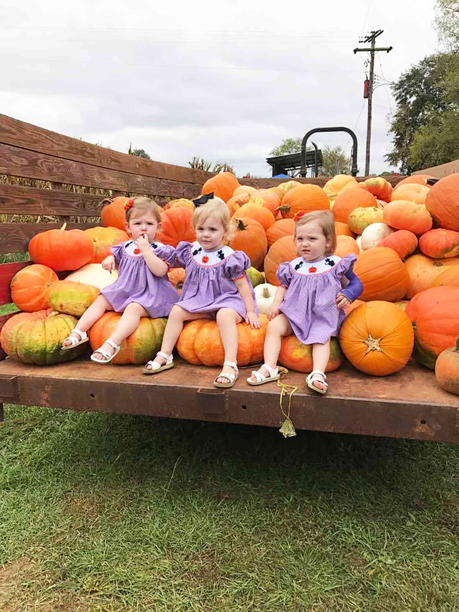Kids Sitting on a Pumpkin Truck
