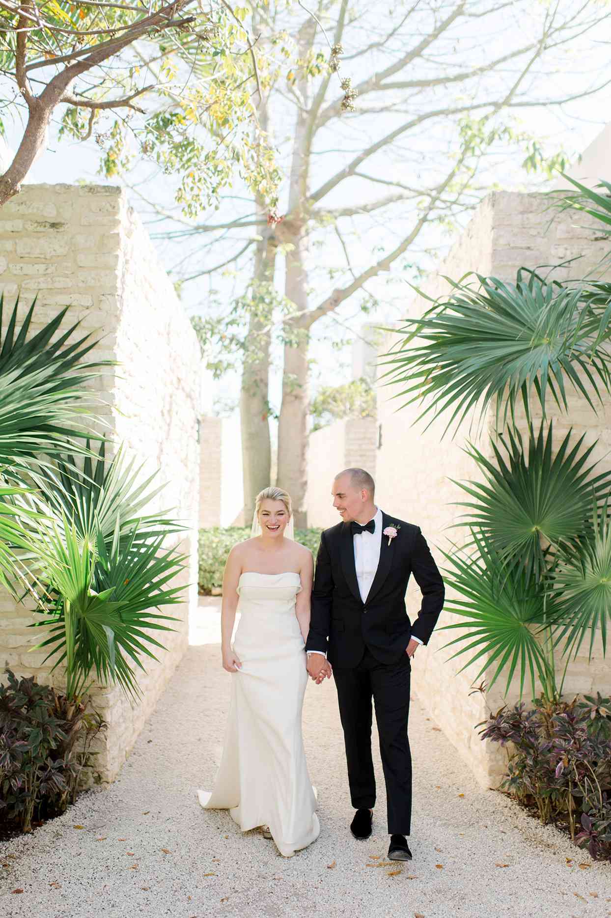 katie nick wedding couple walking through tropical garden