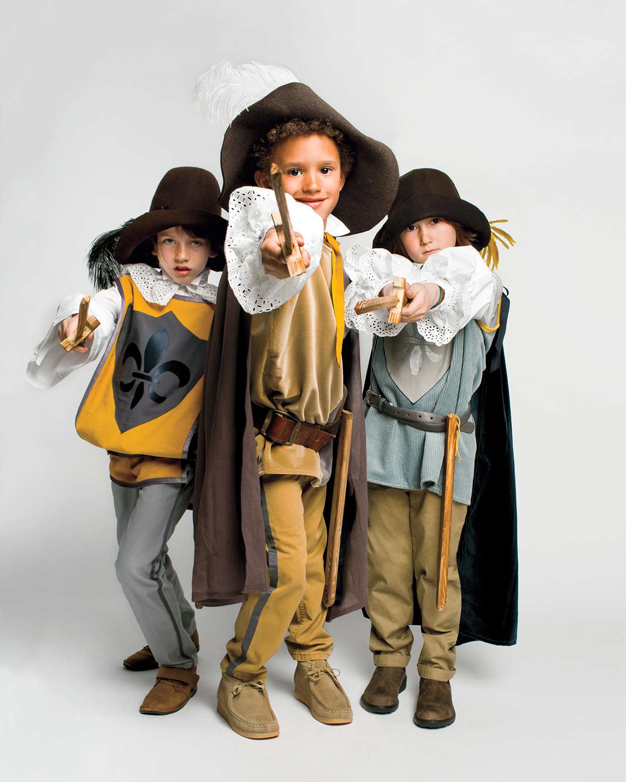 boys in three musketeers halloween costumes