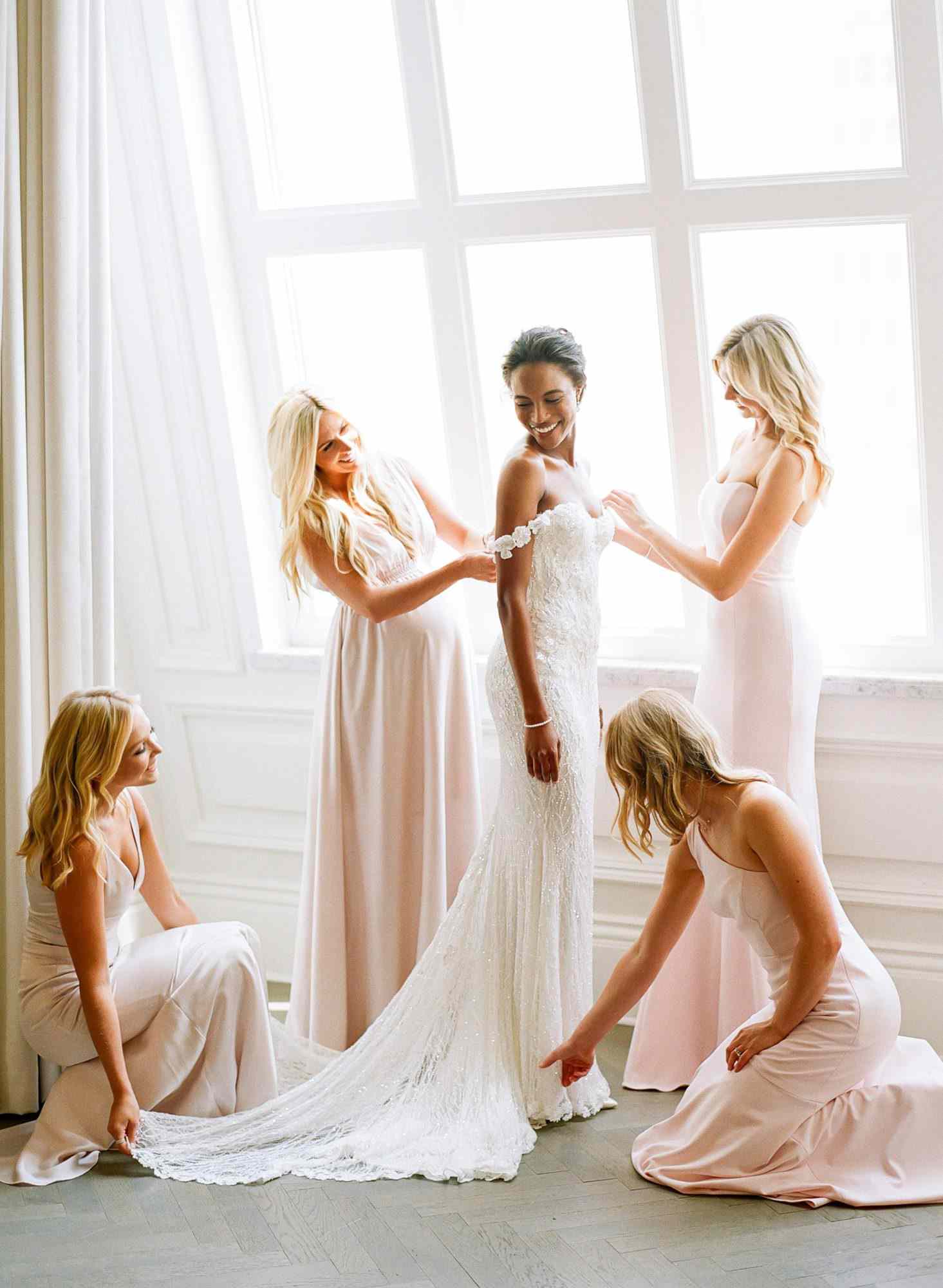 olivia colling wedding bride with bridesmaids ini blush dresses