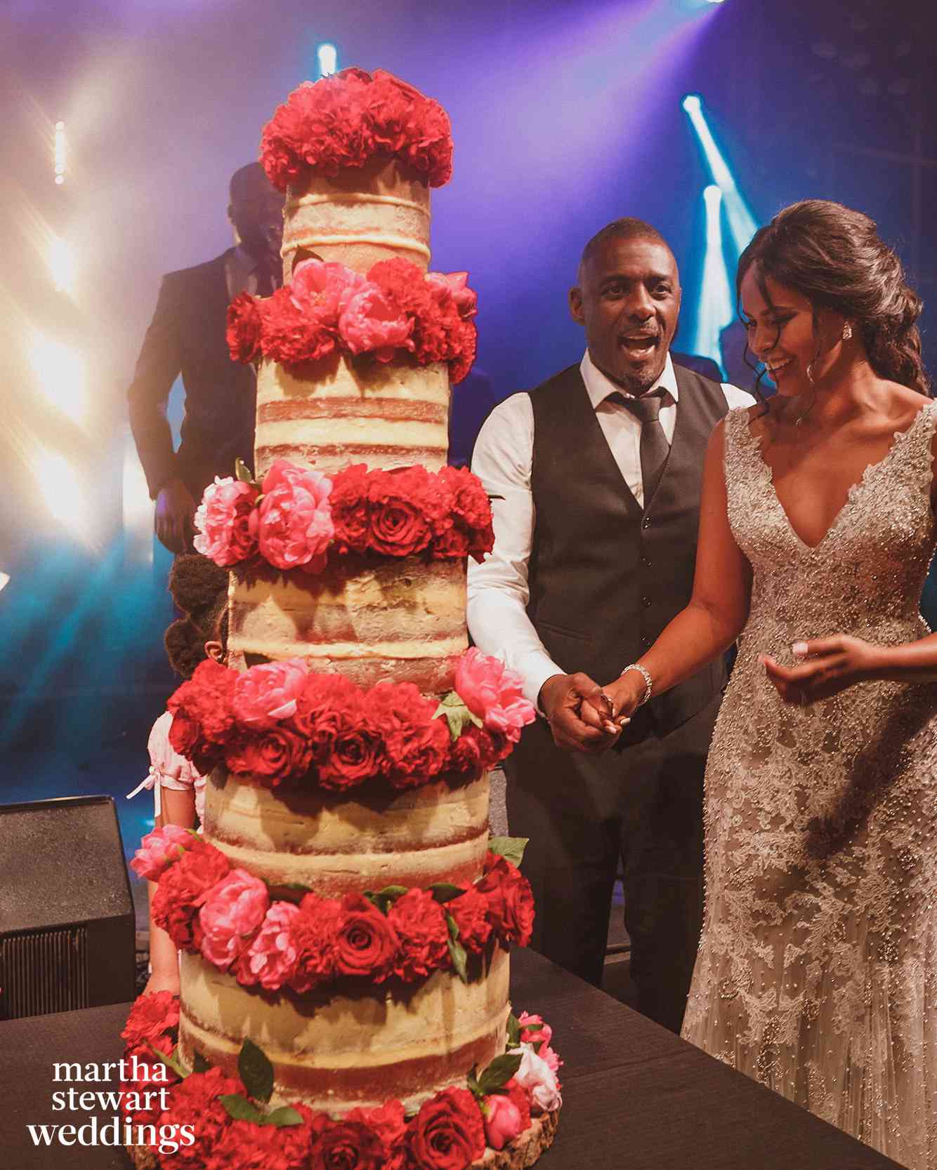 idris and sabrina elba cutting wedding cake