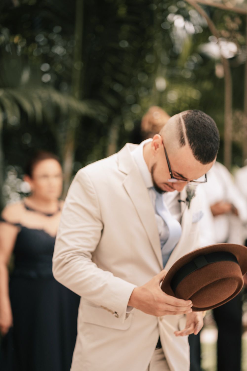 groom tipping hat wedding ceremony