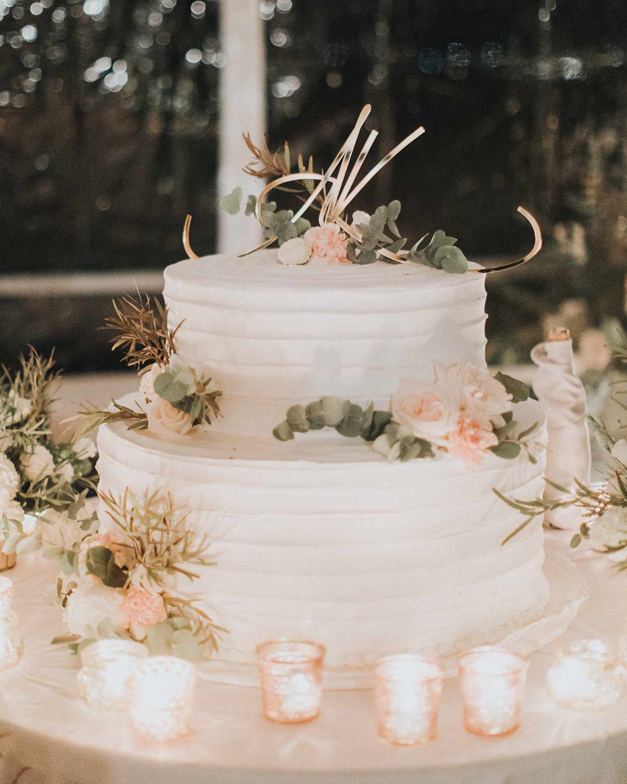 kiira arthur wedding cake with candles around it