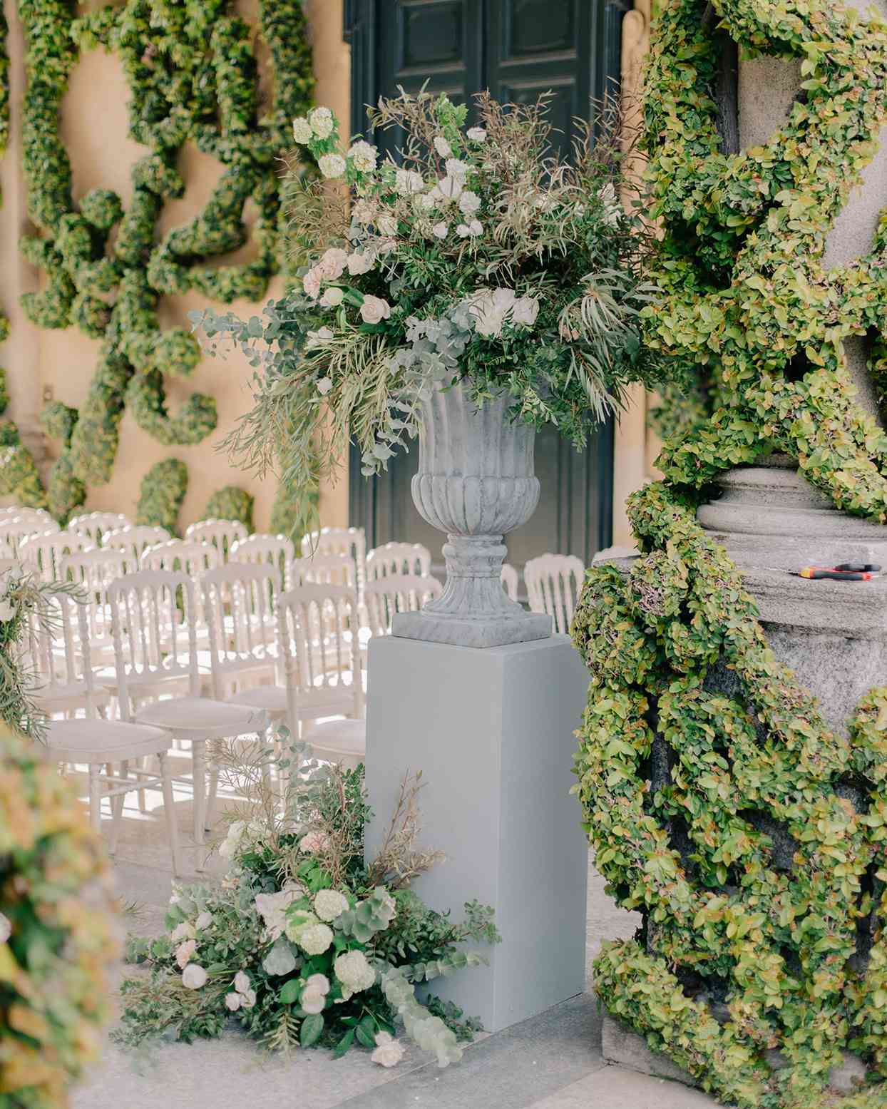 kiira arthur wedding ceremony space with large floral and greenery bouquets