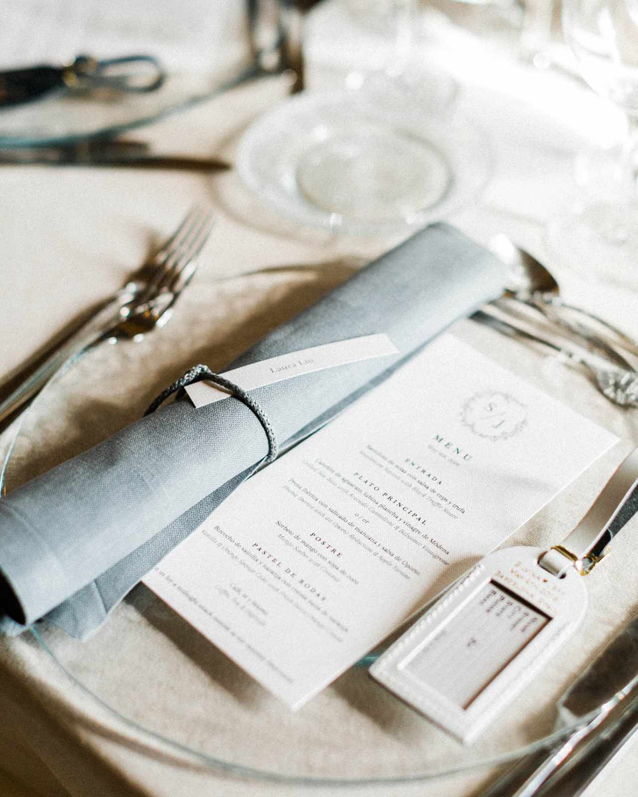 translucent plate with menu and luggage tag favor