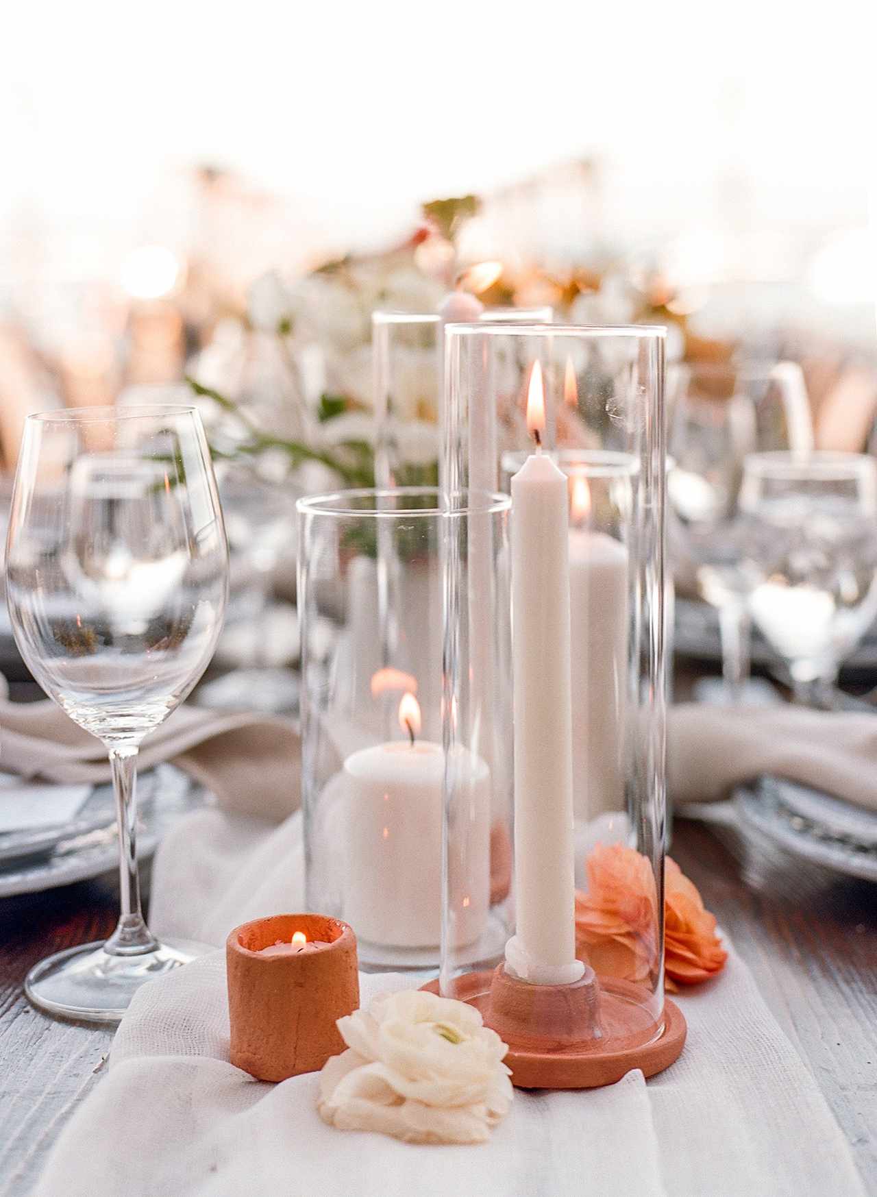 white candle terra cotta table centerpiece