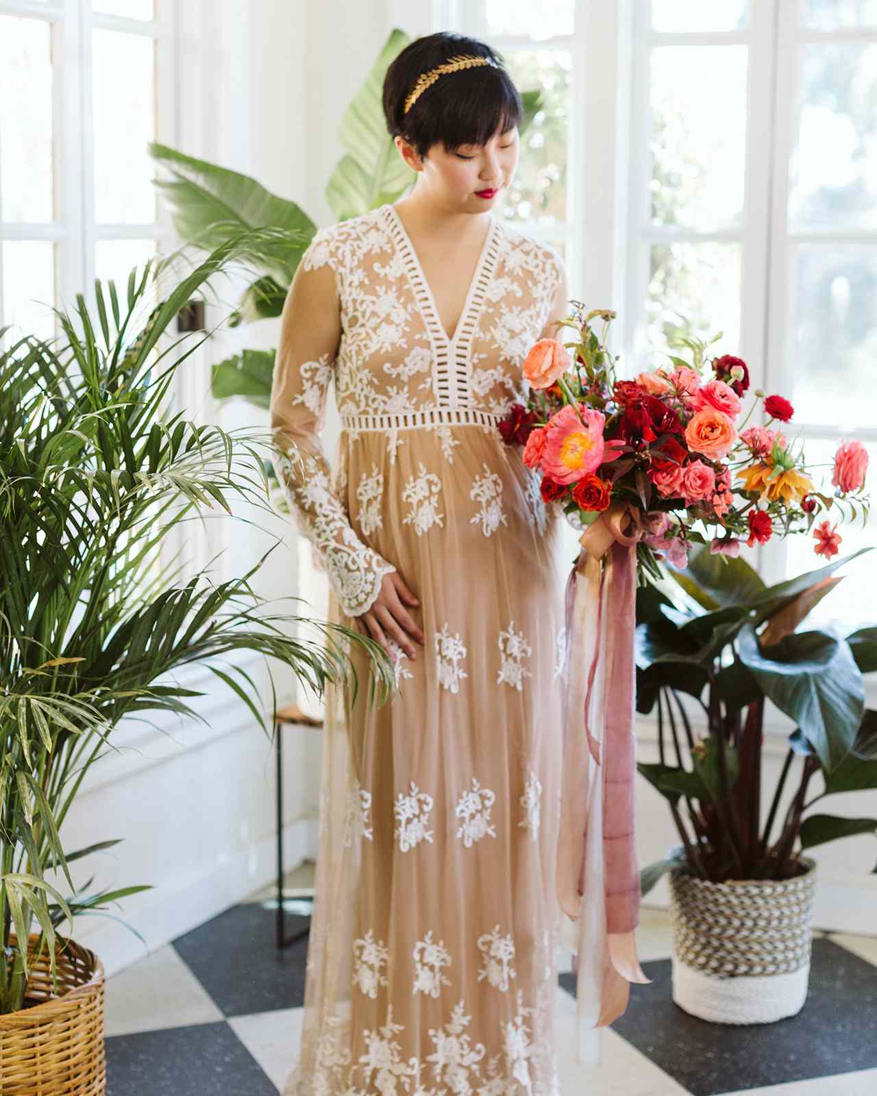 floor-length nude gown v-neckline and long sleeves