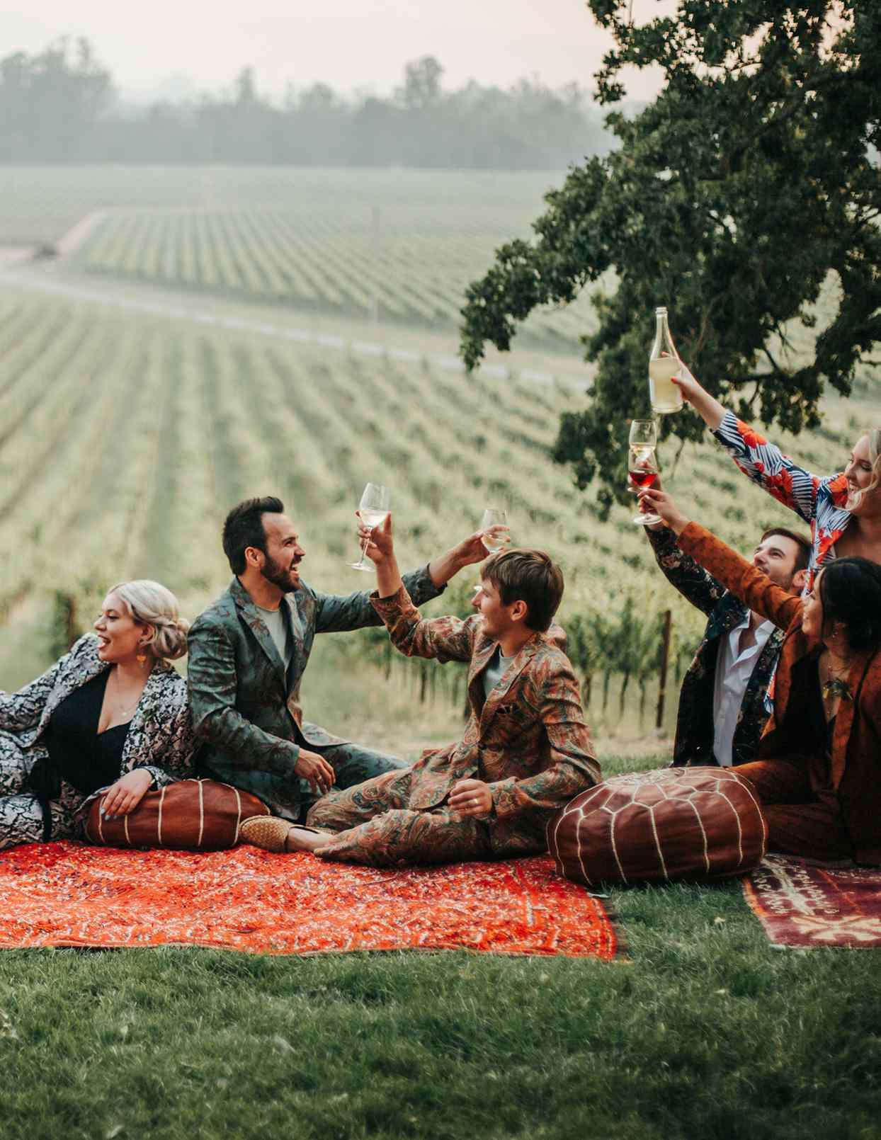 austin alex wedding couple toasting on Moroccan rugs