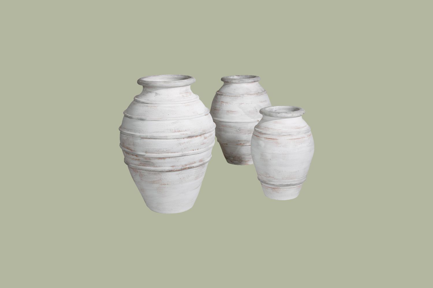three whitewashed terracotta urns