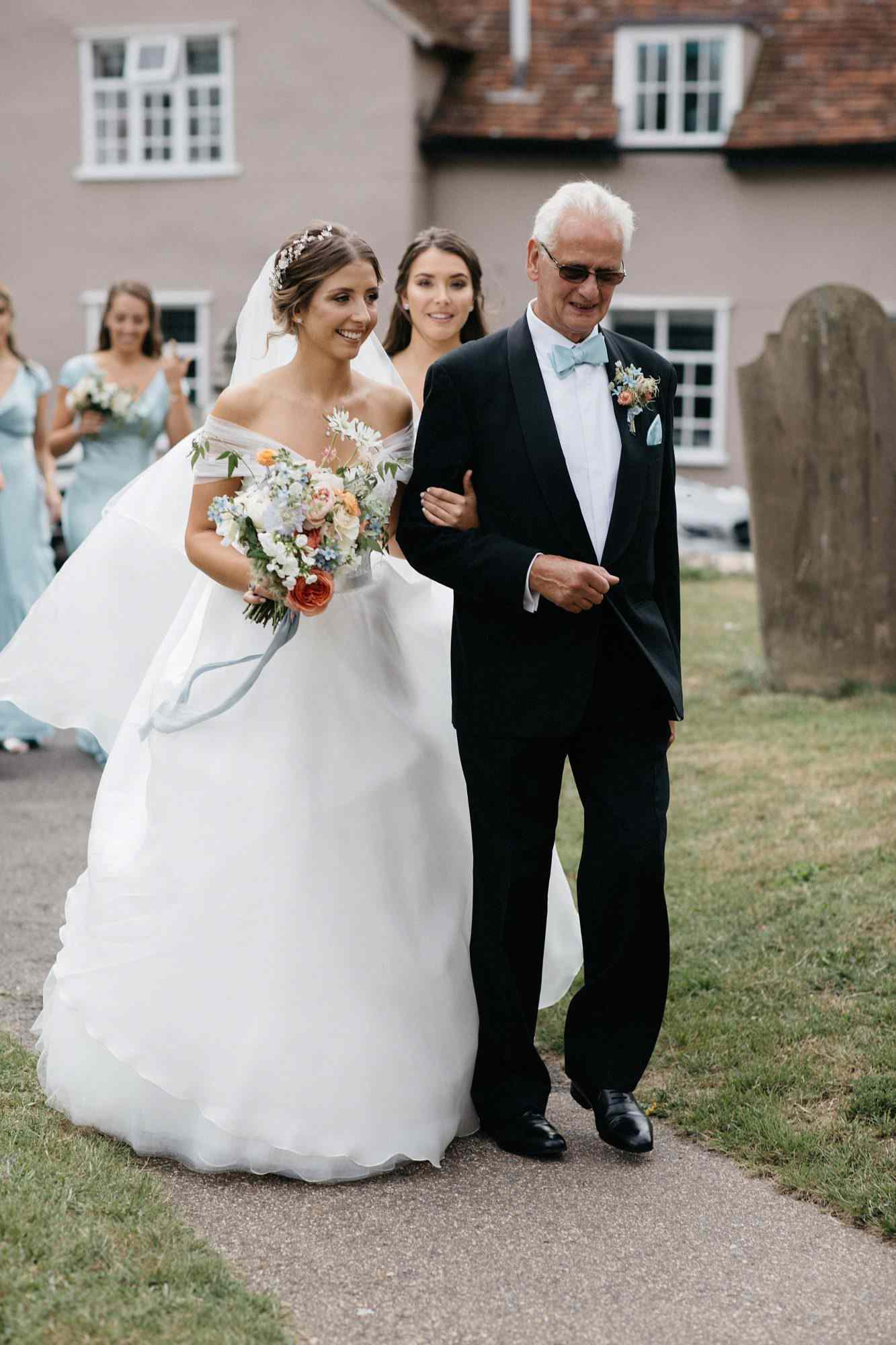 laurie lee wedding bride walking down the aisle with father