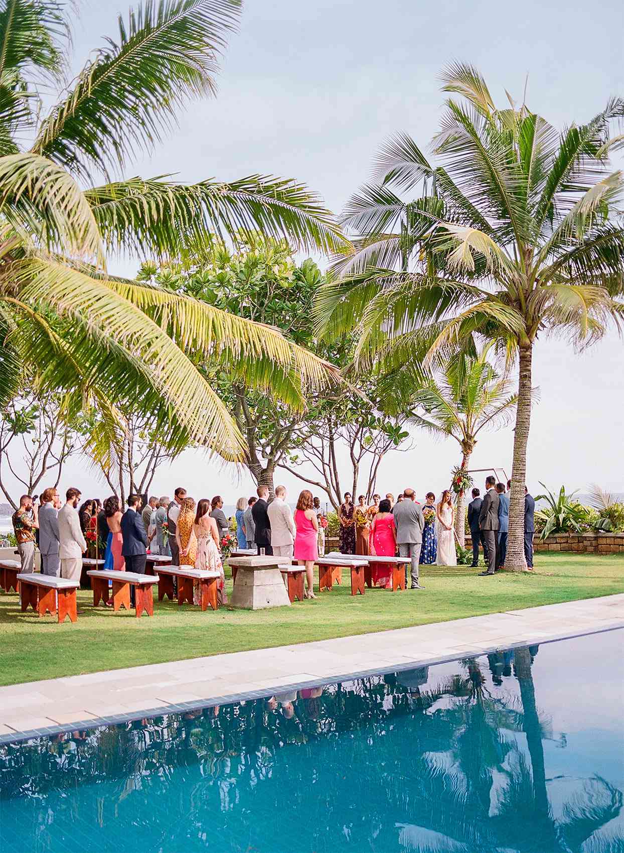 kelly sanjiv wedding ceremony under palm trees