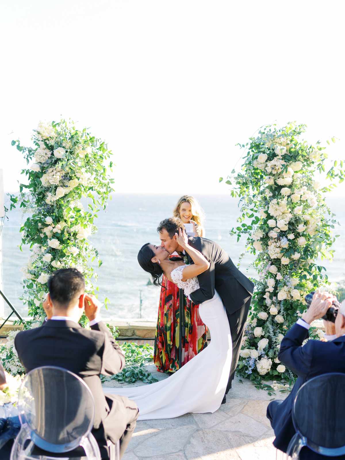 bettina gino wedding ceremony kiss overlooking water