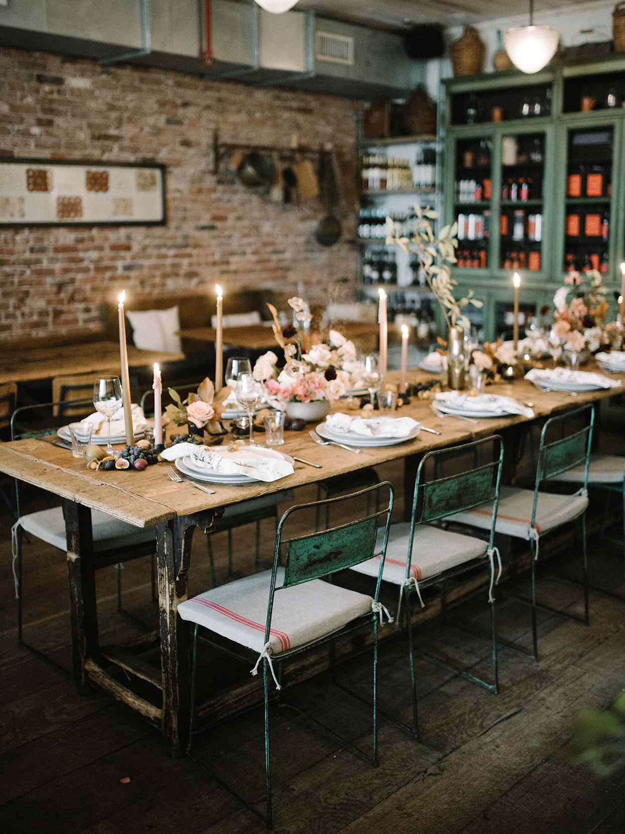 rustic wooden wedding reception tables with industrial chairs