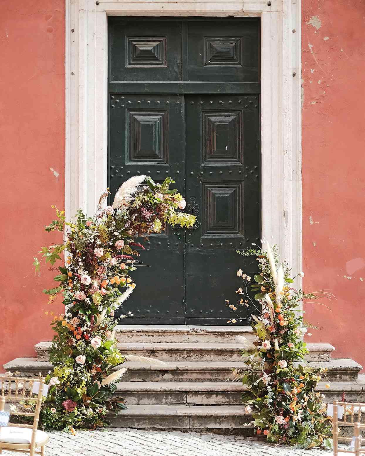 emily scott wedding arch in front of doorway