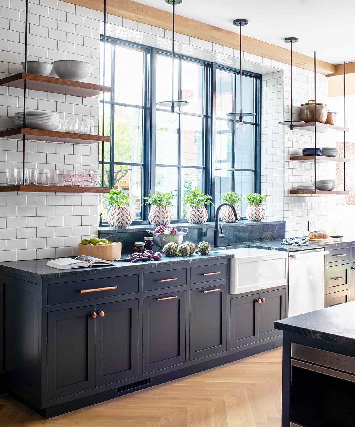 modern dark blue and neutral tones kitchen with bright windows