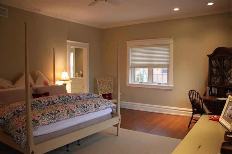 dimly lit neutral tones master bedroom before renovation