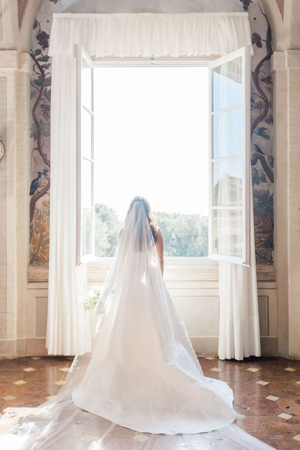 bride gazing out open window